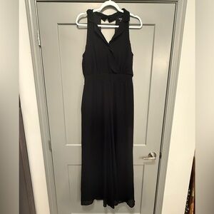 Black wide leg, backless, jumpsuit.